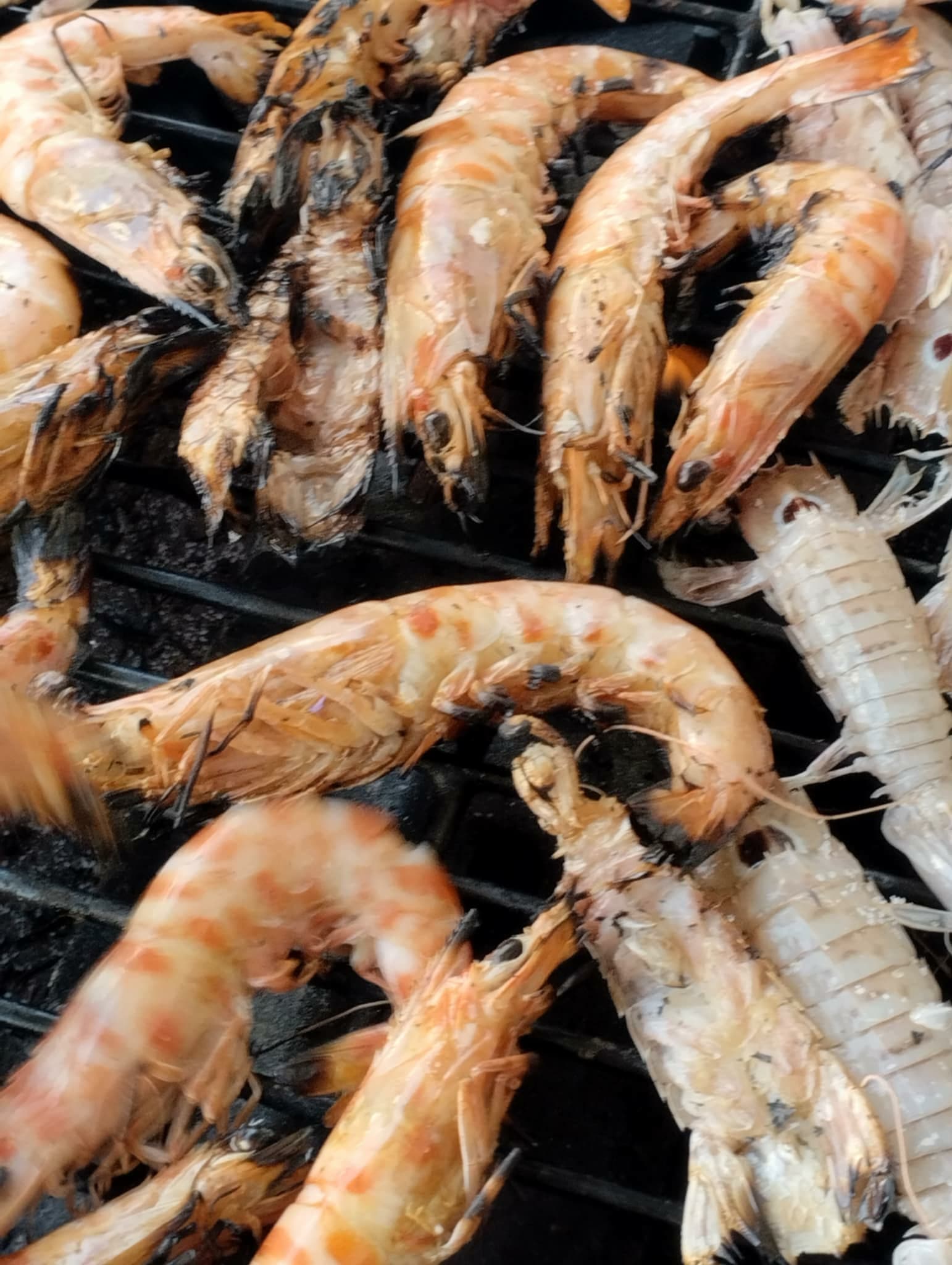 Fresh shrimp sizzling on the grill